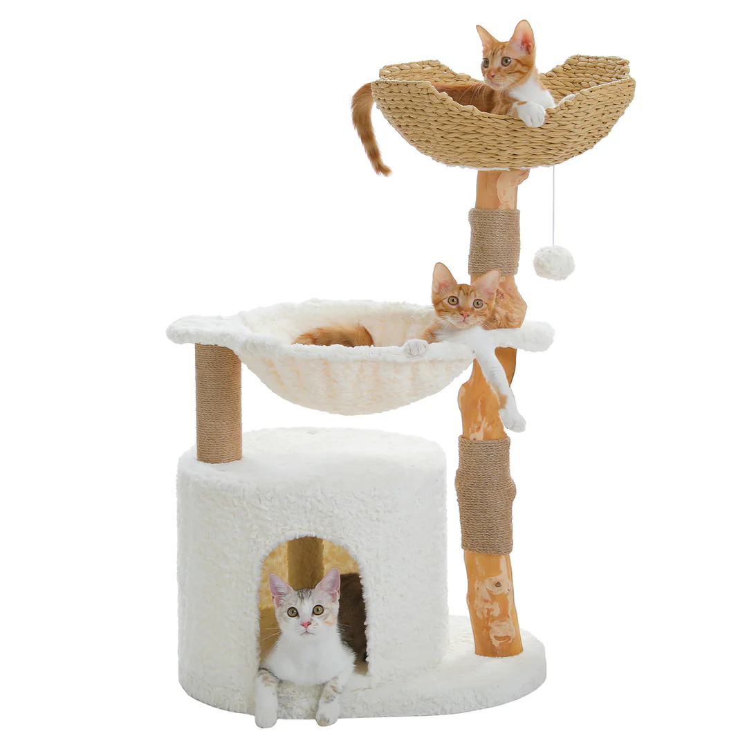 Cat tree with multiple levels and a basket, featuring three cats on a white background. The cat tree features a large wicker basket, a sleeping cave, and a soft white hammock.