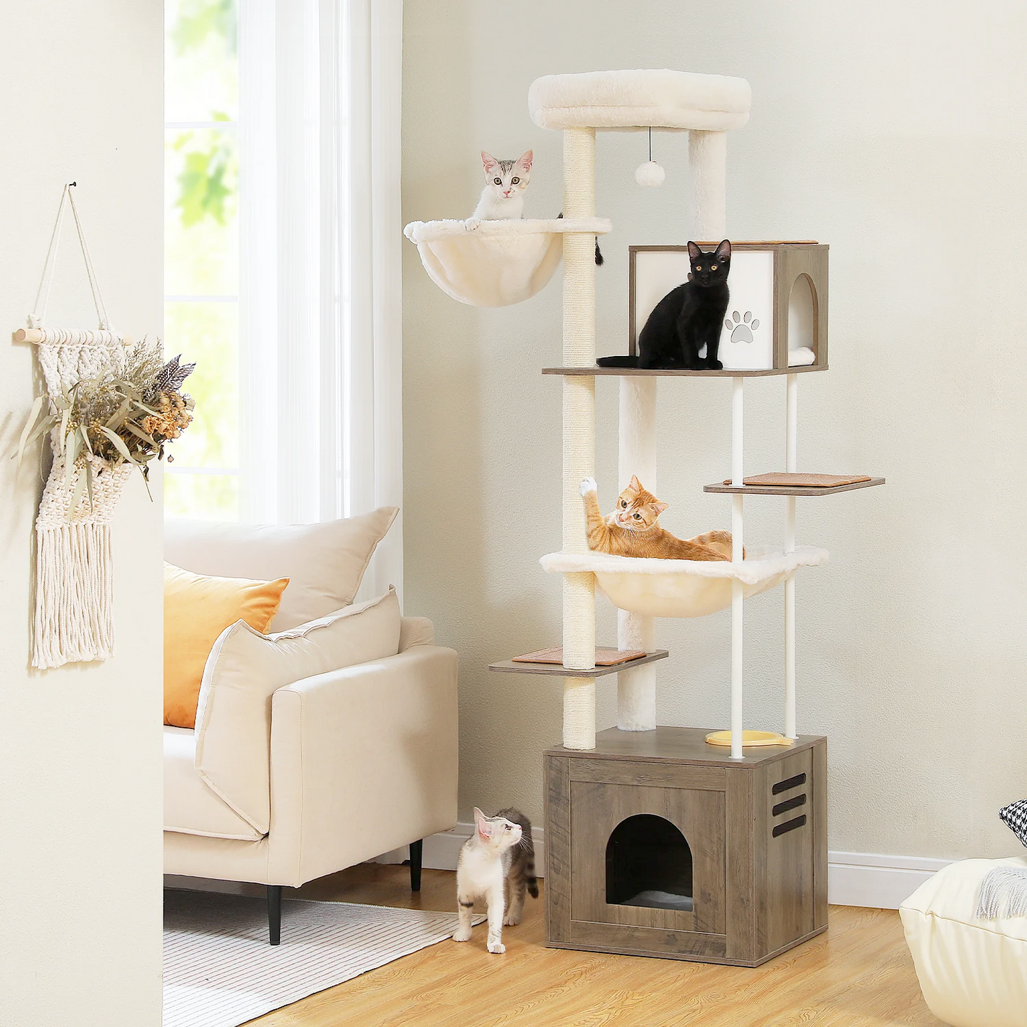 Catopia Co. Canada cat tree. Cat tree with multiple levels and a cat sitting on each level in a living room.