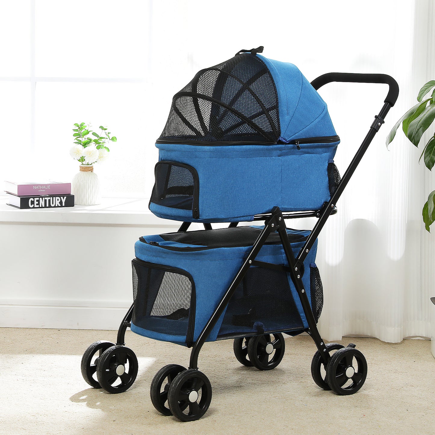 Catopia Co. Canada Blue pet stroller with black wheels on a light-colored floor.