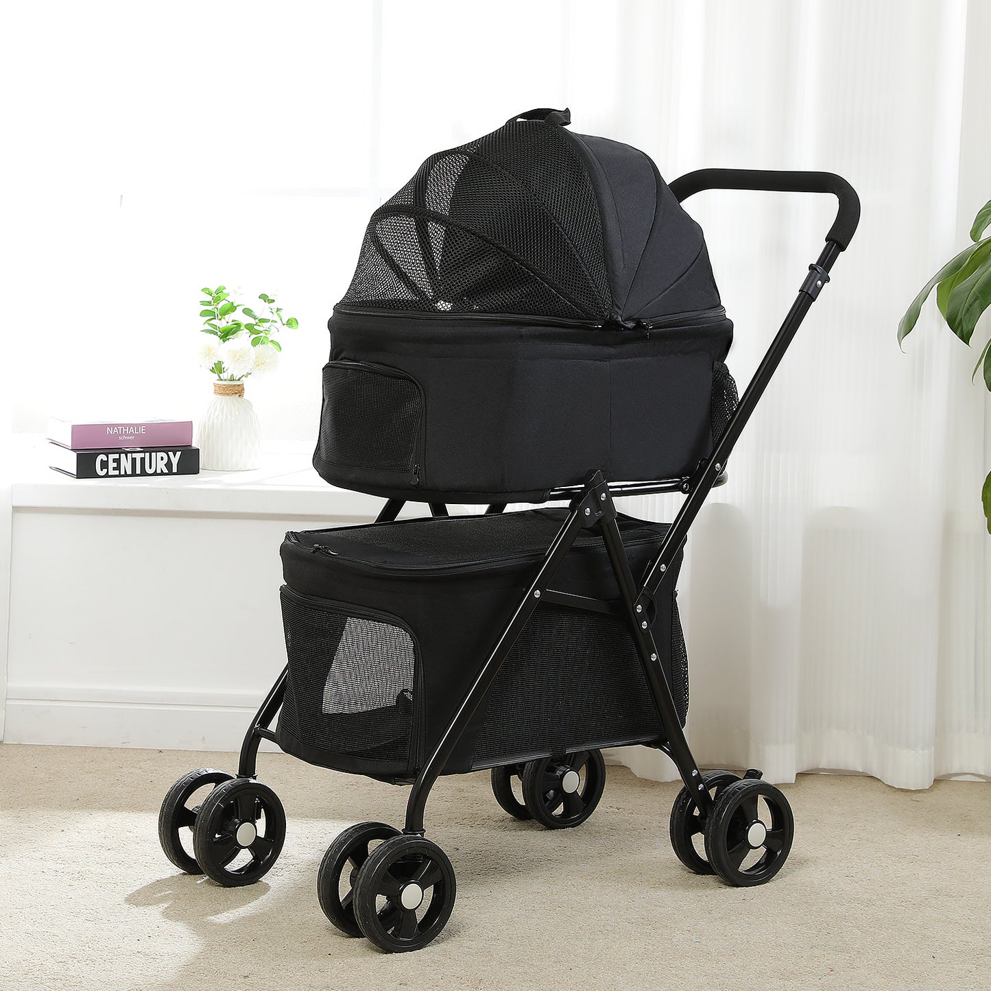 Catopia Co. Canada Black pet stroller on a light wooden floor with white curtains in the background