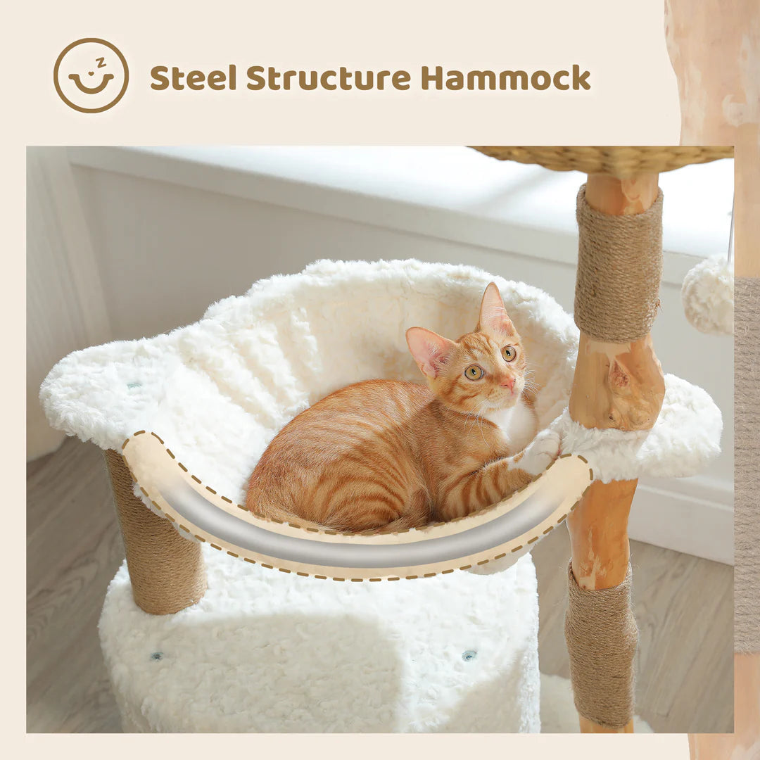 Cat sitting in a white cat hammock attached to a solid wood post of a luxury cat tree