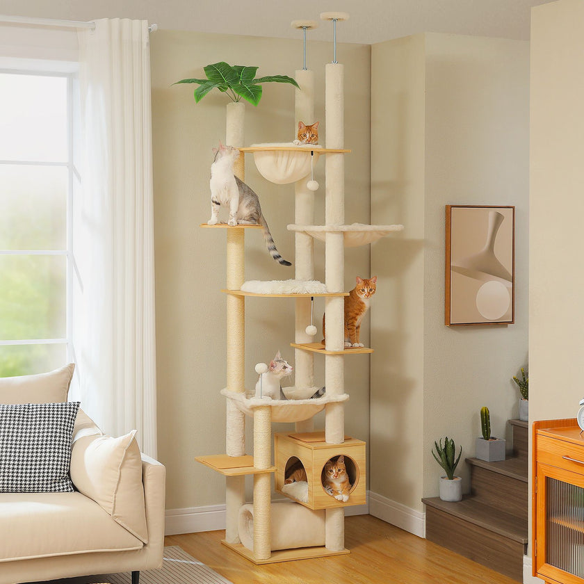 Cat tree with multiple levels and a cat sitting on each level in a living room.