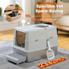 Grey enclosed cat litter box with stainless steel base, litter scoop and tracking step in a living room