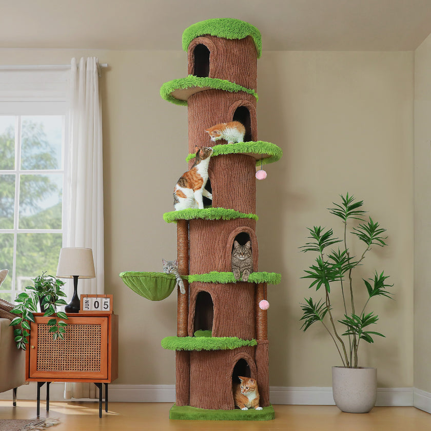 Tall treehouse cat tower with multiple condos, hammock and plush green platforms