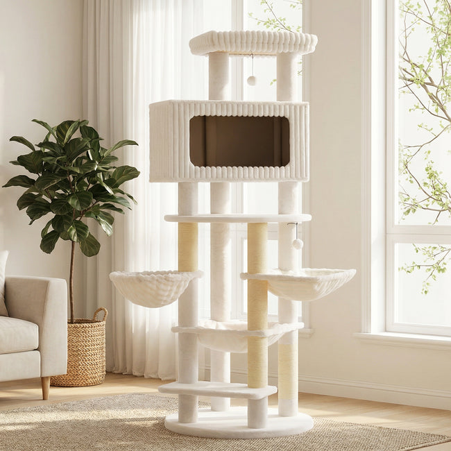 Beige and cream extra tall cat tree with three hammocks, a large condo, scratching posts, and top perch in a bright living room