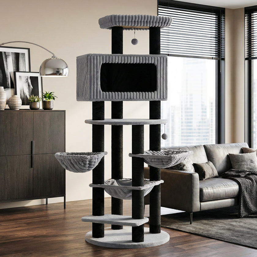Black and grey extra tall cat tree with three hammocks and a large enclosed condo in a modern living room