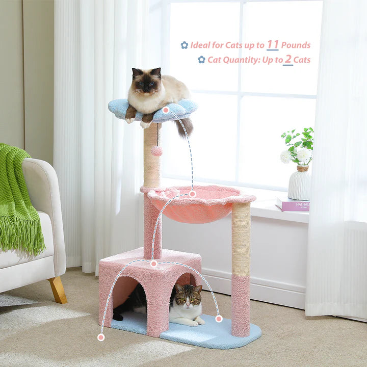 Cat tree with multiple levels and a pink platform in a room with a window and plant.