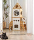 Catopia Co. Modern Rocket ship Cat Tower with cats inside and around it, featuring a plant and candle in the background.