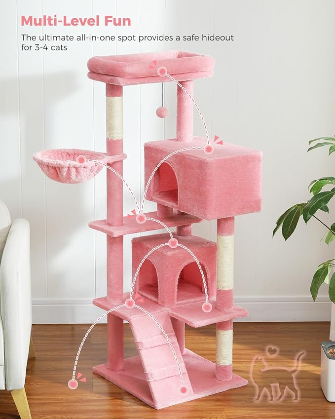 Pink multi-level cat tree with various perches and a slide on a wooden floor.