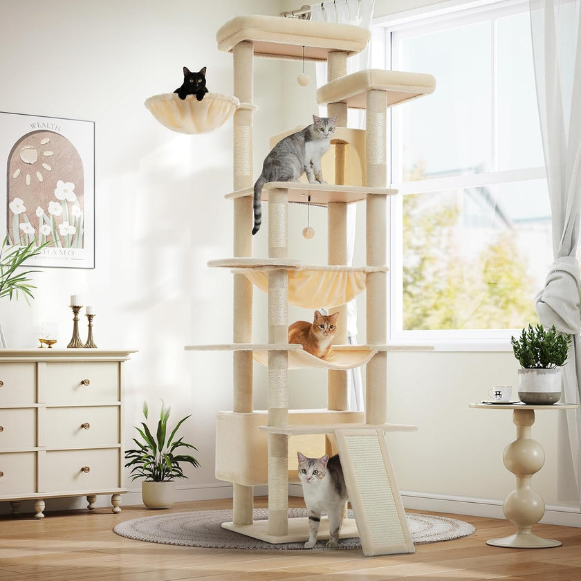 Cat tree with multiple cats in a room with a window and furniture.