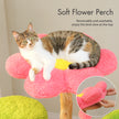 Cat resting on a soft pink flower perch with removable and washable padded cover