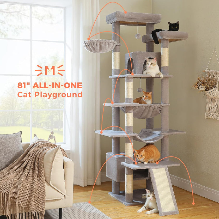 Cat tree with multiple cats on different levels in a room with a window and chair.