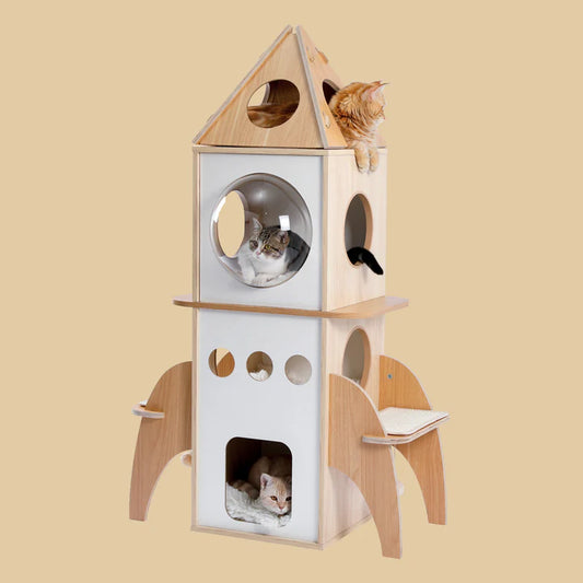 Cat tree with multiple levels and round windows on a beige background. The cat tree is wooden and rocket-ship shaped cat play tower with a cat inside in a modern room setting