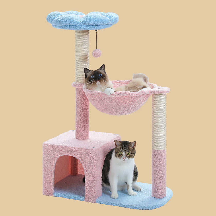 Cat tree with pink cushion, blue platform, and hammock with two cats on a beige background