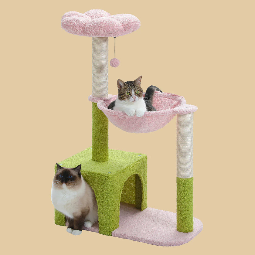 Cat tree with green base, pink platform, and pink cushion on a beige background