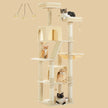 Modern cream cat tree by Catopia Co., shown with multiple cats enjoying hammocks, condos, and platforms. This tall and elegant cat tower is perfect for multi-cat homes in Canada. Canadian business, local shipping only.