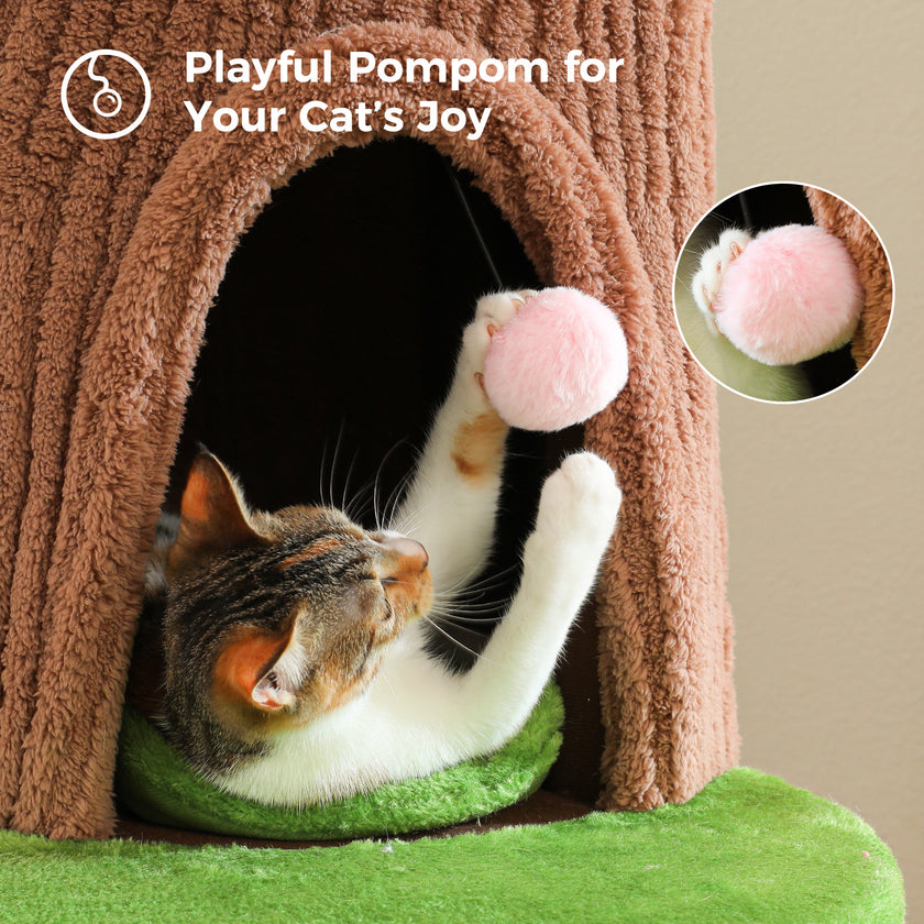 Cat playing with a pink hanging pom-pom toy inside a brown plush condo on a flower cat tree