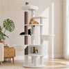 White 188 cm tall cat tree with two hammocks, large condo, padded top perch, and sisal scratching post in a bright living room